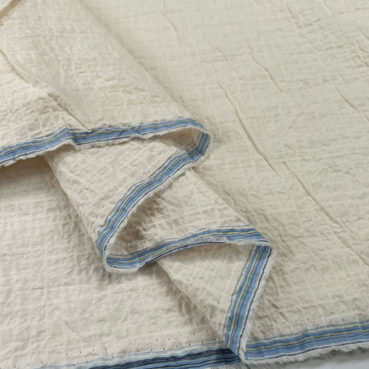 59th Street Organic Cotton Cream Seersucker Fabric Fold