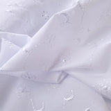 5 Hole Broderie Anglaise Fabric Moons White Close Up