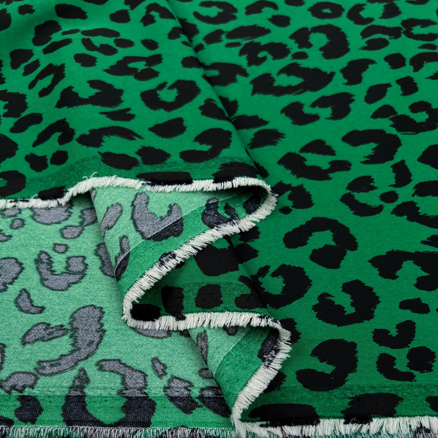 After Dark Green Polyester Elastane Twill Stretch Black Animal Print Dress Fabric Fold