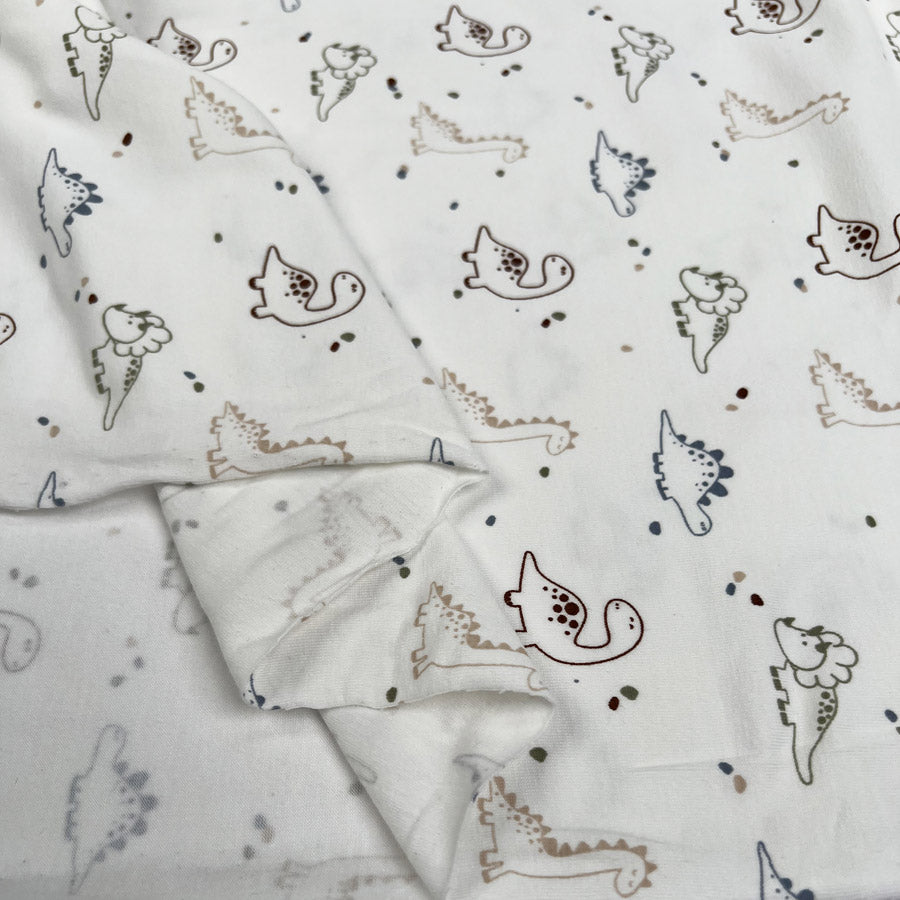 Cotton Jersey Prehistoric Cream Dinosaur Print Elastane Knit Fabric Fold
