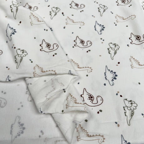 Cotton Jersey Prehistoric Cream Dinosaur Print Elastane Knit Fabric Fold