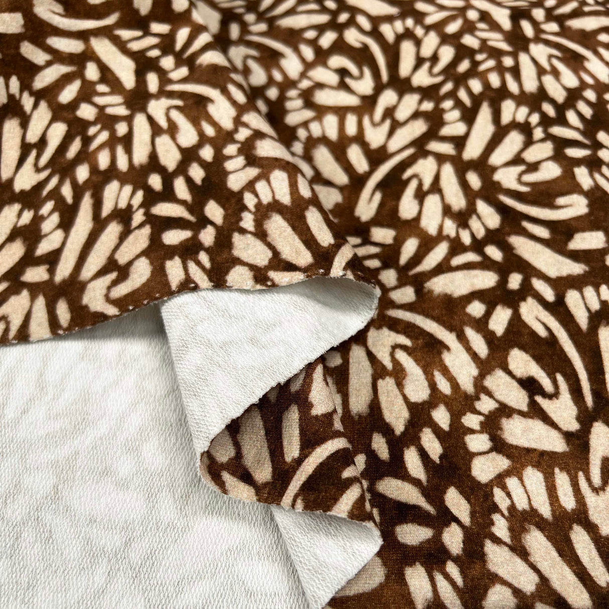 French_Terry_Nala_Brown_Beige_Abstract_Print_Cotton_Elastane_Knit_Jersey_Fabric_Fold
