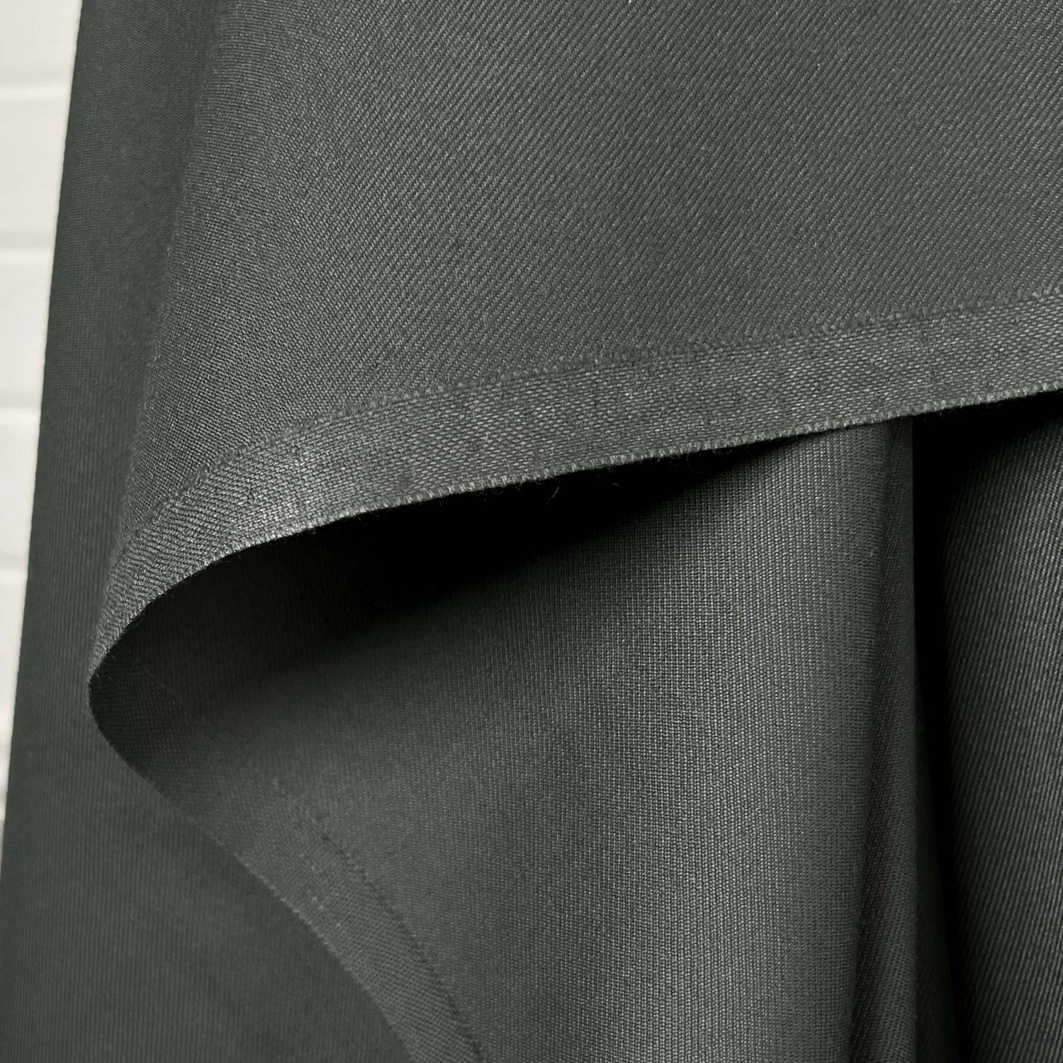 Gambrella Polyester Wool Green Fine Twill Suiting Fabric Hang