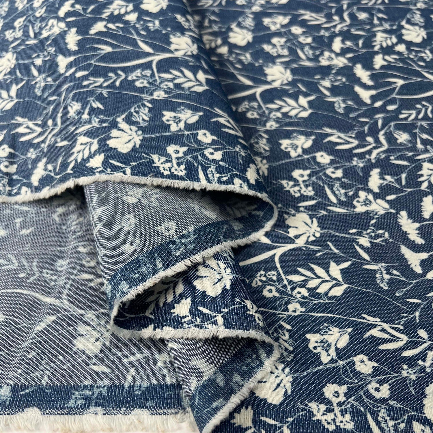 Heavenly Hedgerow Cotton Denim Chambray Blue White Floral Print Lightweight Woven Dress Fabric Fold