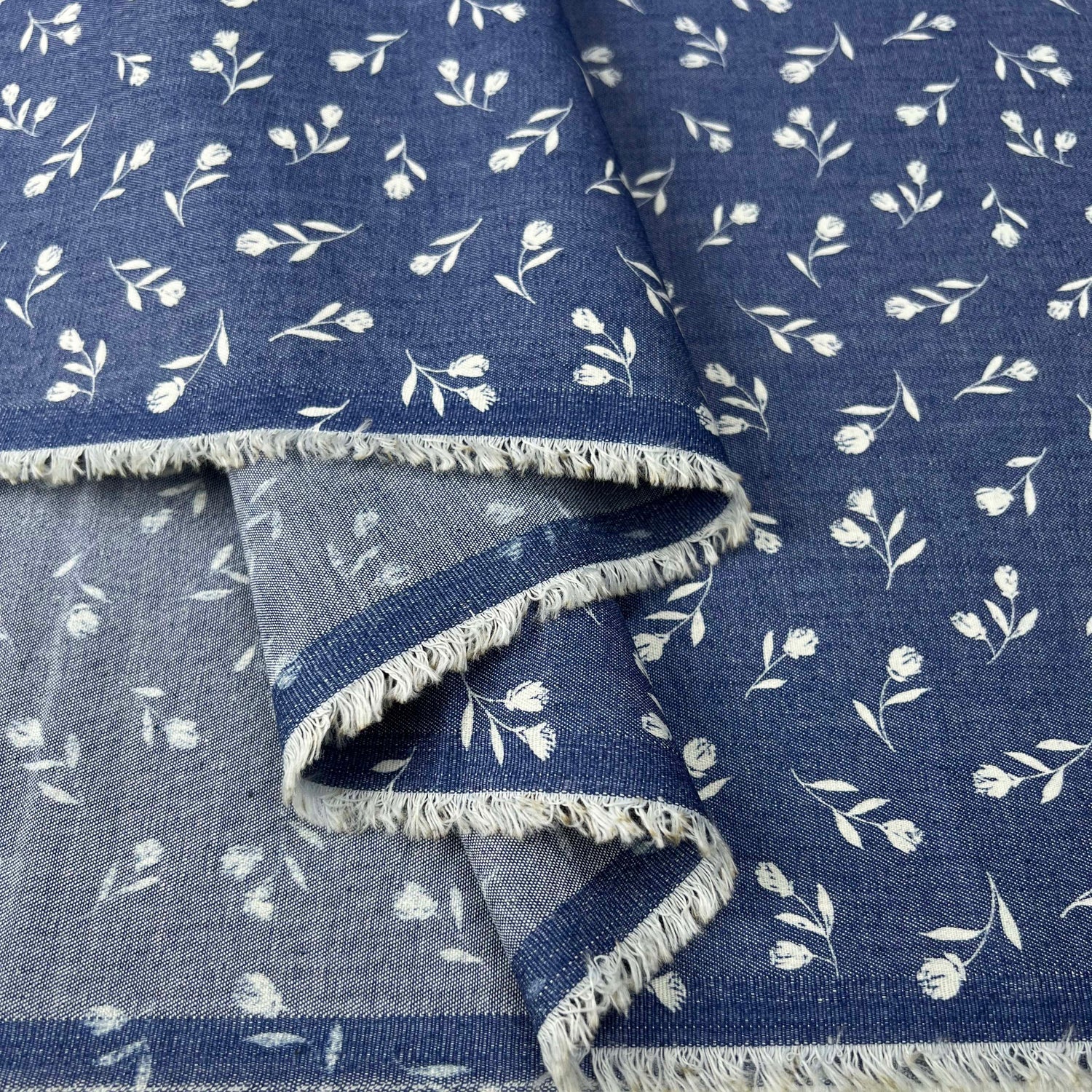 Heavenly Sprigs Cotton Denim Chambray Blue White Floral Print Lightweight Woven Dress Fabric Fold