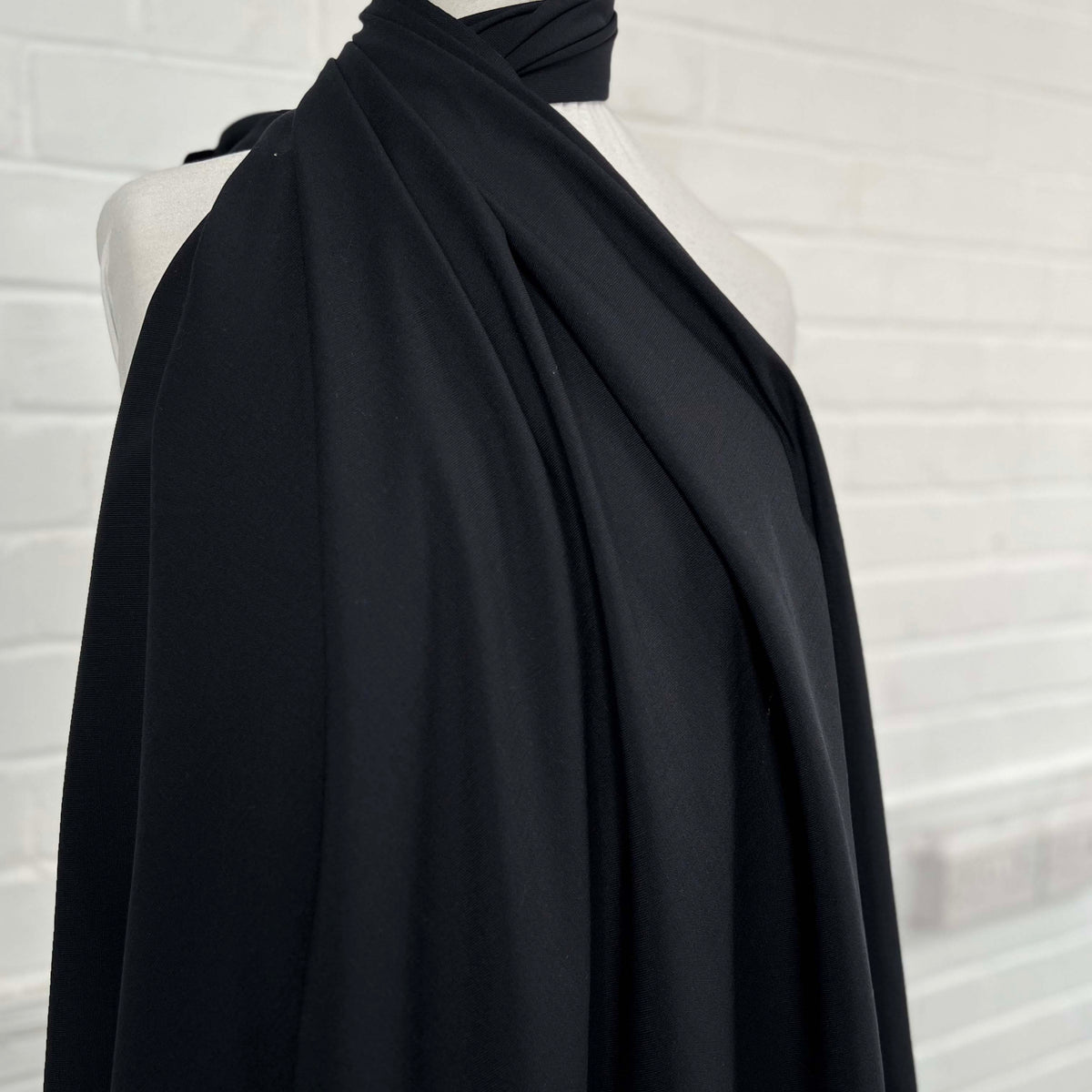 Black Polyester Wool Lycra Dressmaking Fabric Here to Eternity Mannequin