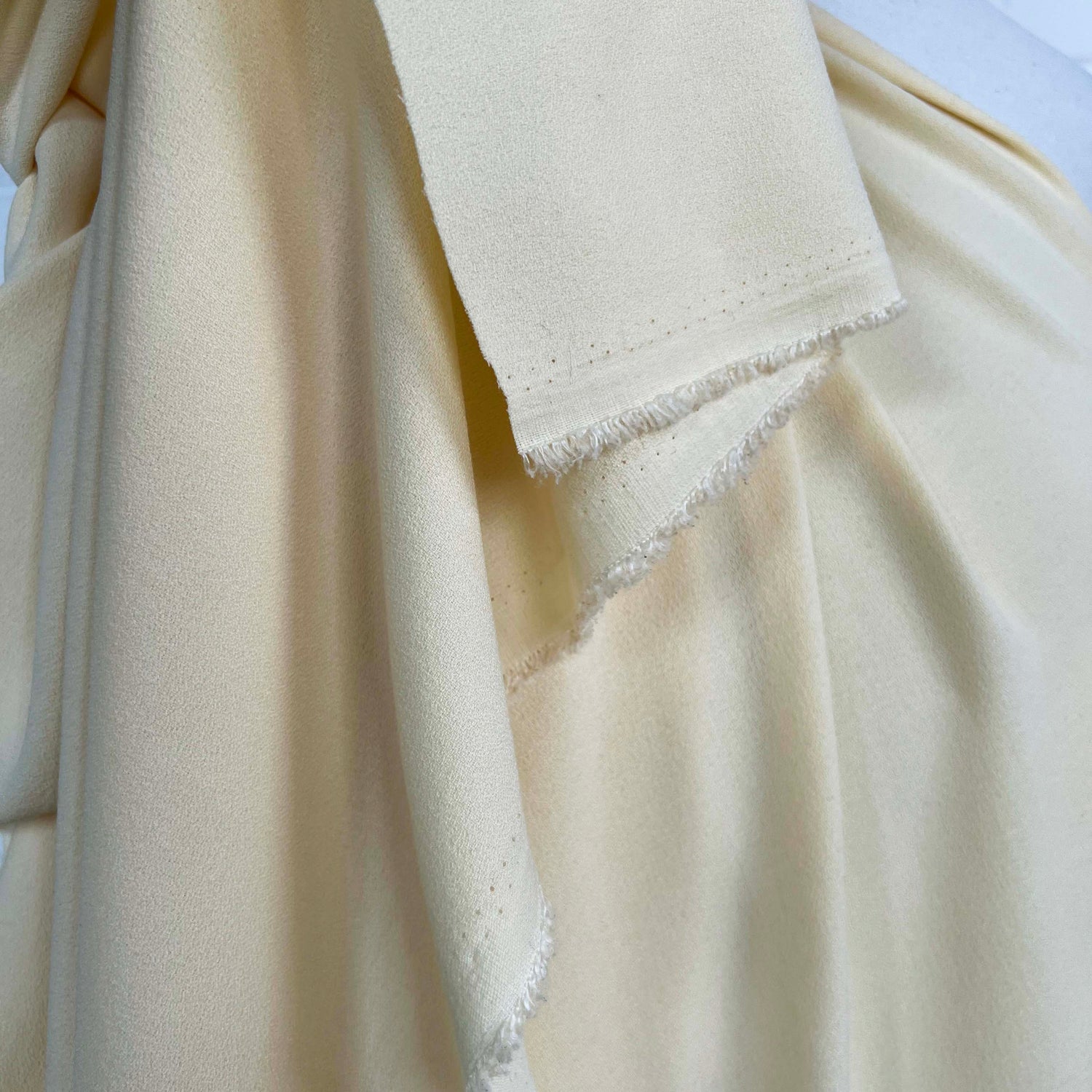 Soft Stretch Textured Dressmaking Fabric Italian Crepe Cream Hang