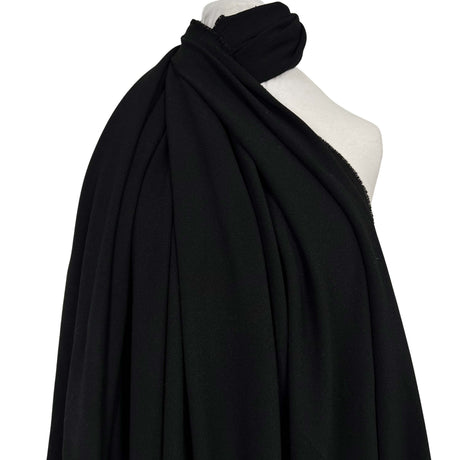 Moving Well Polyester Wool Elastane Black Midweight Portuguese Suiting Fabric Mannequin