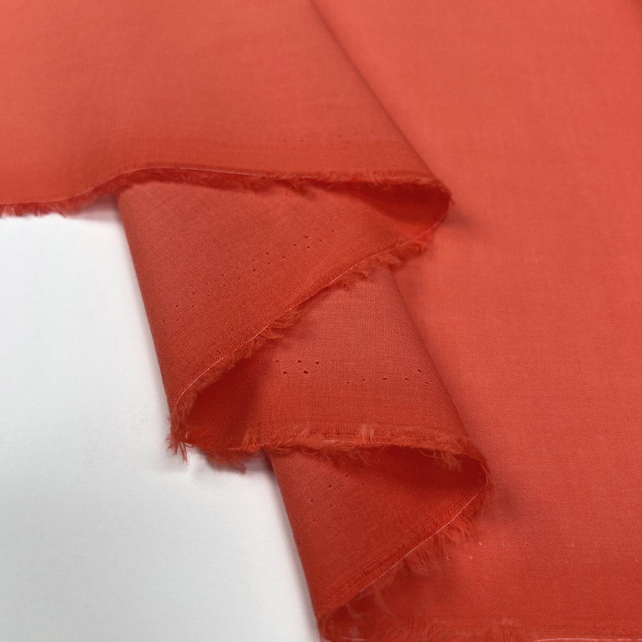 Pennine Cotton Lawn Coral Plain Woven Fine Lightweight Dress Fabric Fold