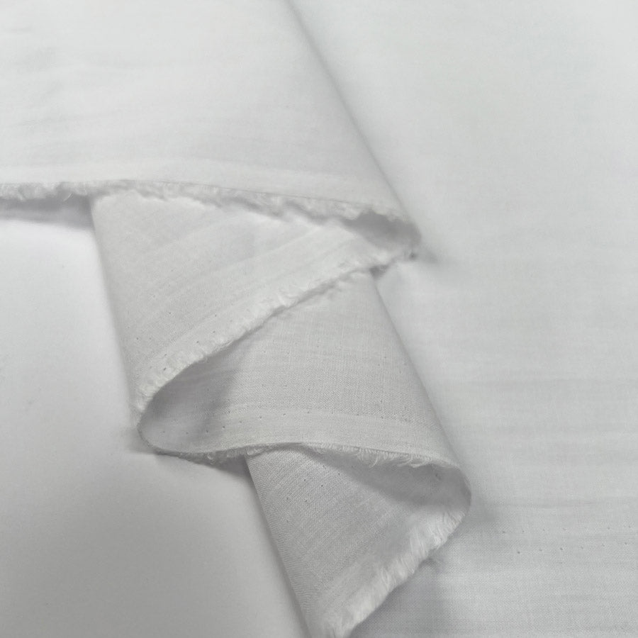 Pennine Cotton Lawn White Plain Woven Fine Lightweight Dress Fabric Fold