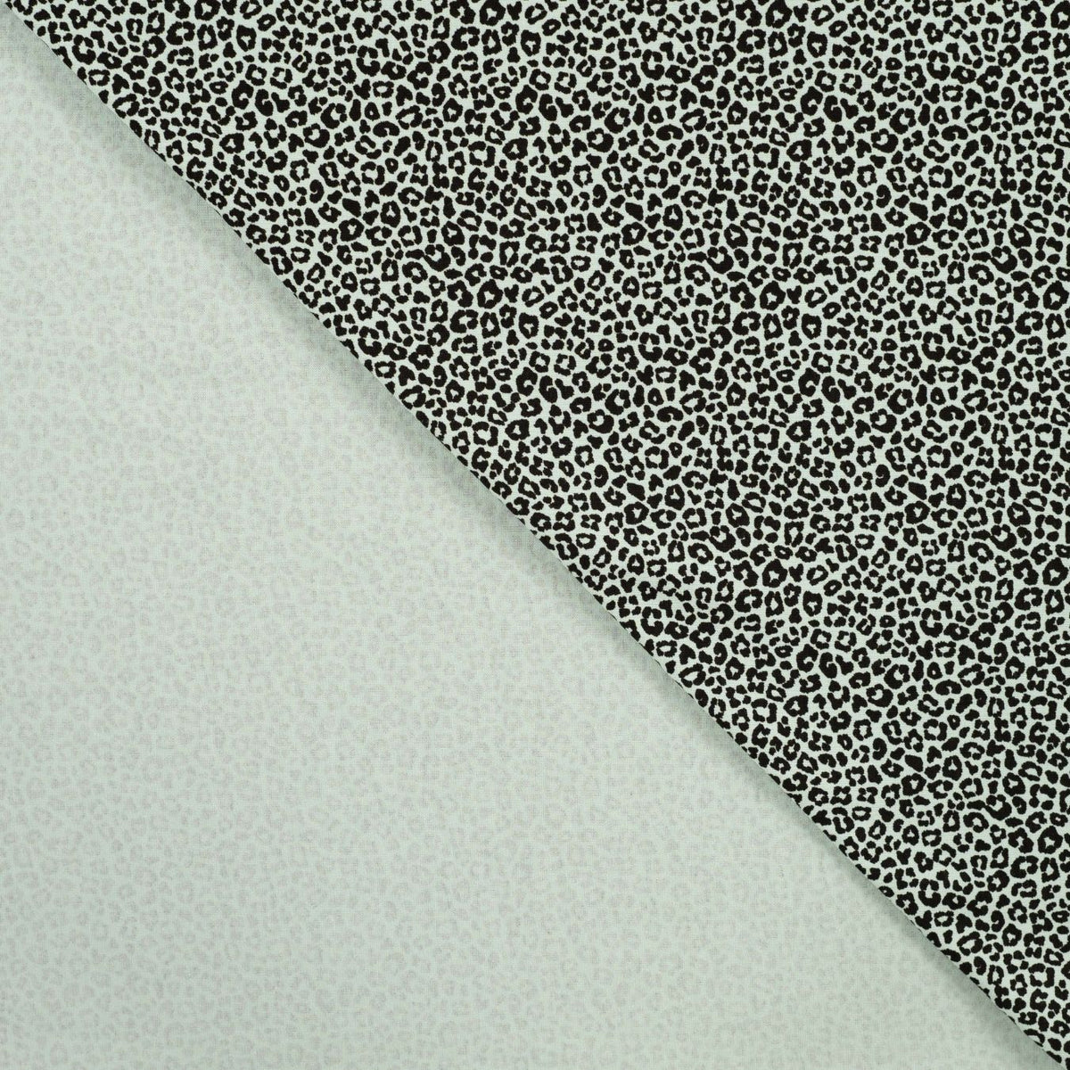 Pocket Panther Mint Animal Print Knitted Cotton Jersey 200gsm Dress Fabric Fold
