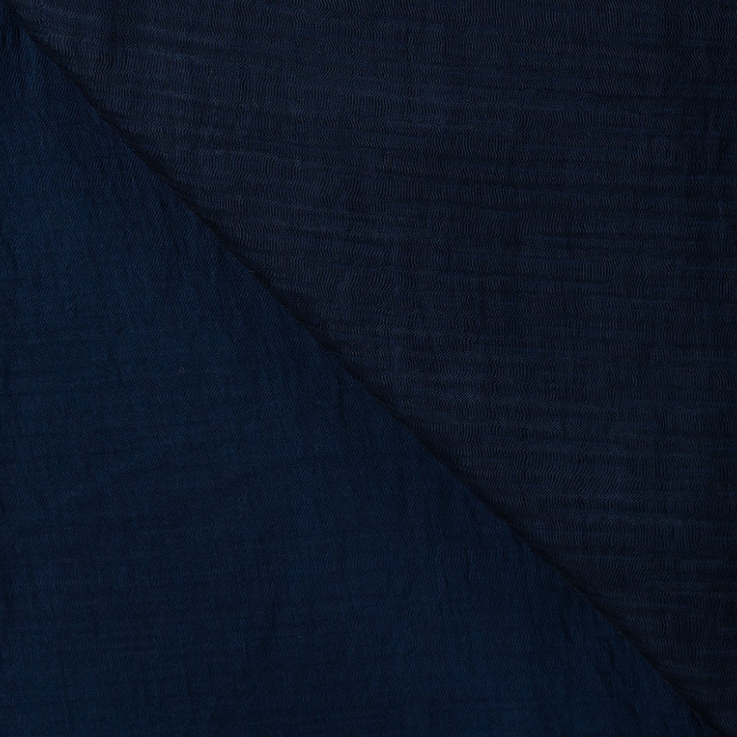 Tencel Ripple Navy Silky Smooth Woven Dress Fabric fabric, folded