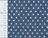 Denim Quilt Stars Print Blue Quilted Cotton Dress Fabric fabric, with ruler for scale