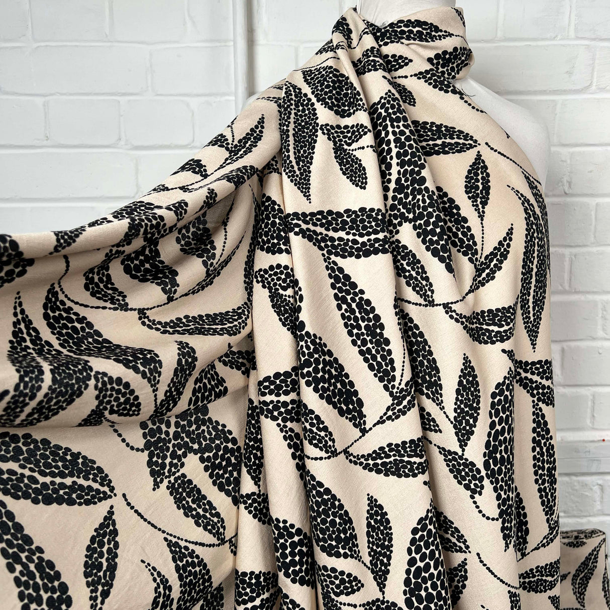 Beige Black Leaf Print Dress Fabric | Viscose Marocain Spot The Sand Mannequin