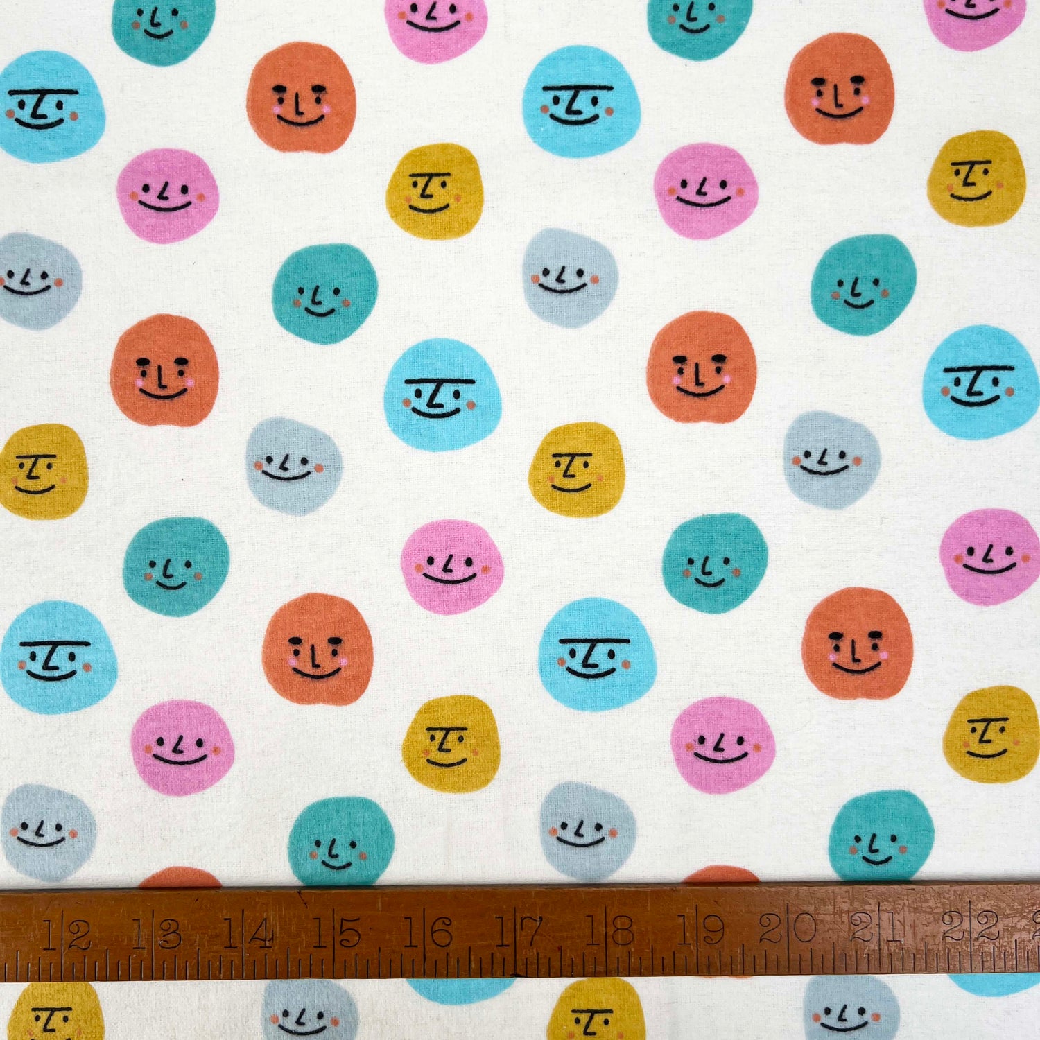 Winceyette Many Faces Cream Multi Cotton Polyester Soft Brushed Flannel Childrens Fabric Ruler
