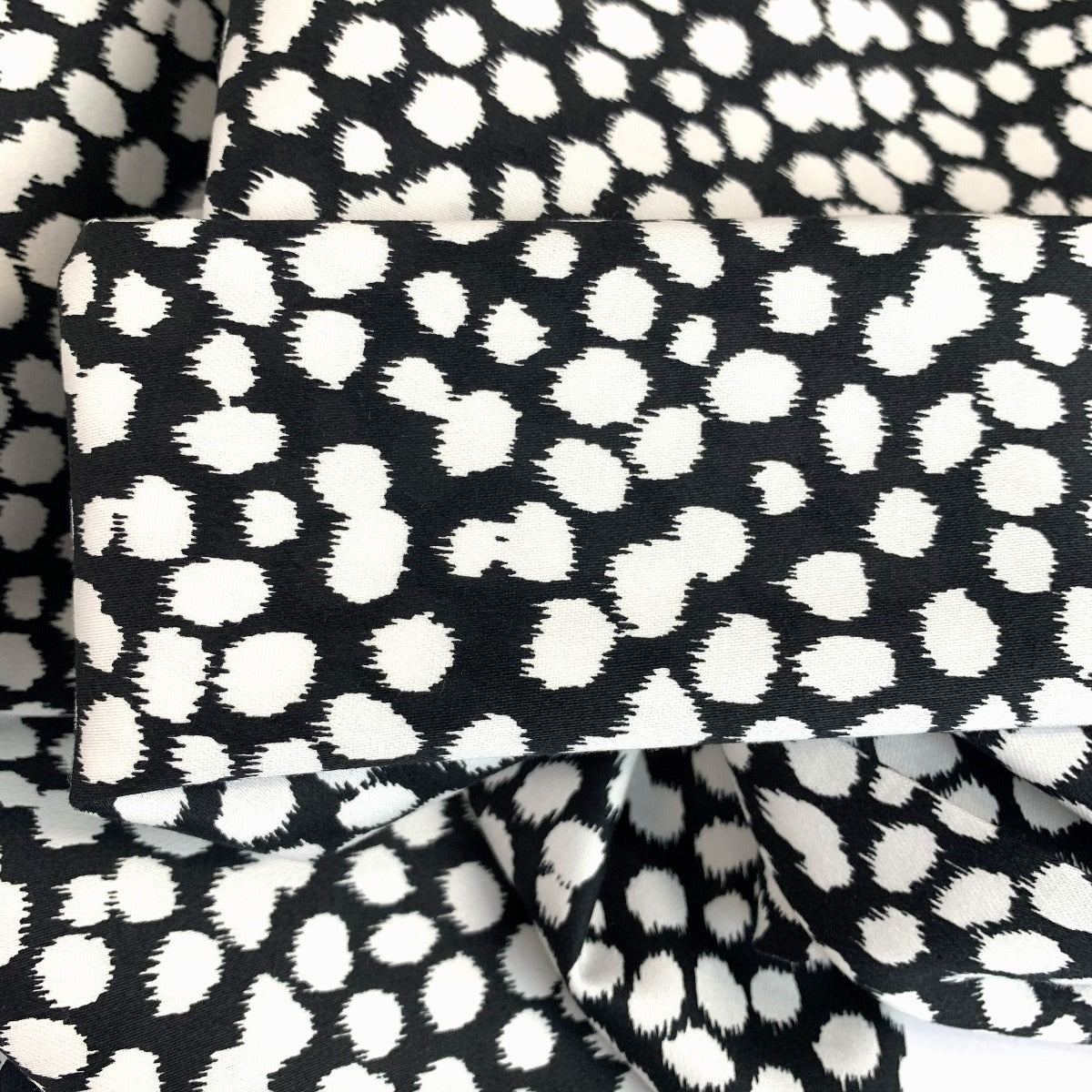 An Elegant Take Laurent Spotty Black White John Louden Stretch Woven Dress Fabric Fold 4Ef4858E B5Ba 4Deb A46B 34Fa54E823E8