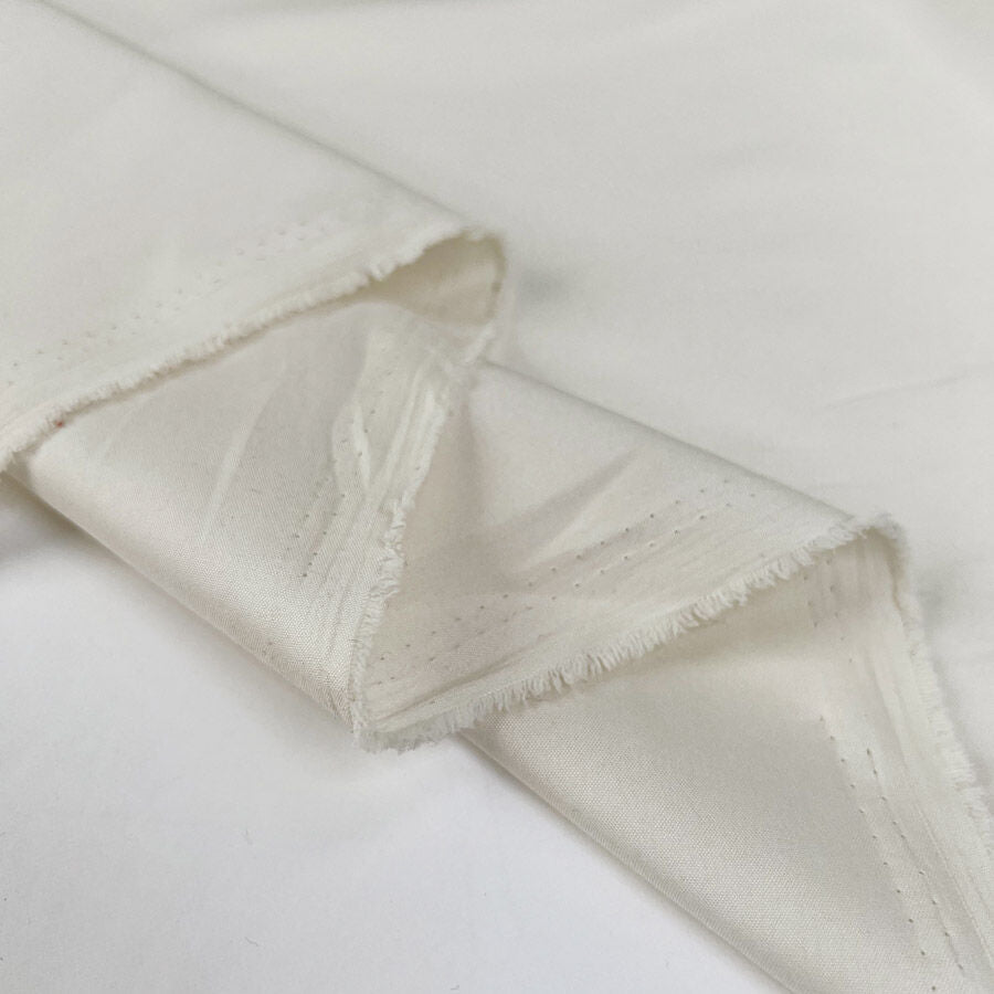 Buttermilk Lining Cream Fine Woven Nylon Fabric Fold