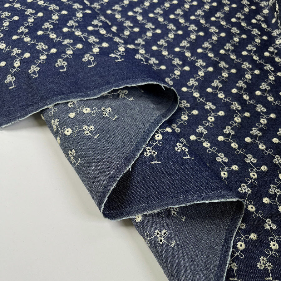 Chambray Anglaise Dark Blue Floral Embroidered Woven Dress Fabric Fold