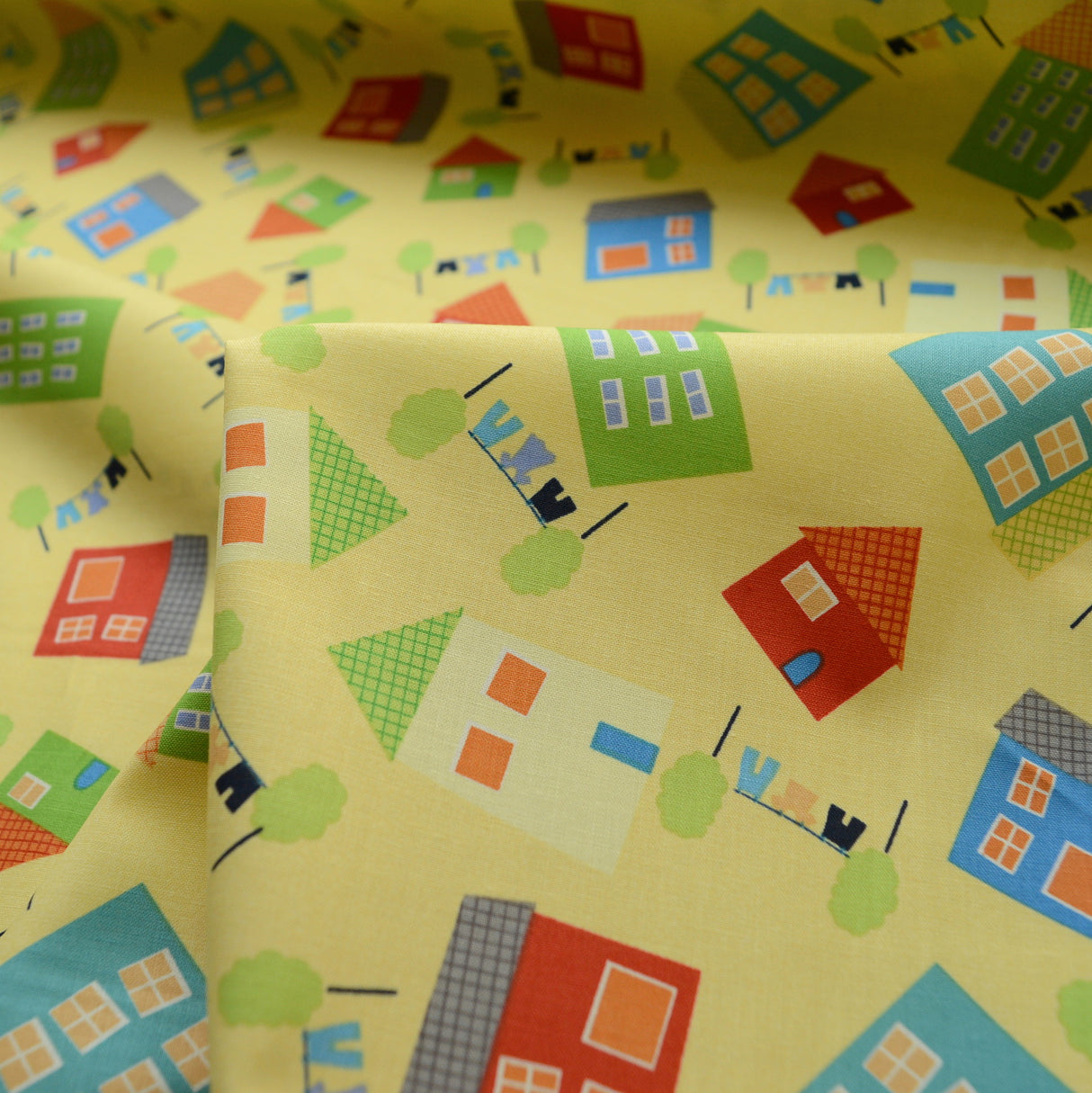Clothworks Tumble Town Yellow House Print Cotton Cu