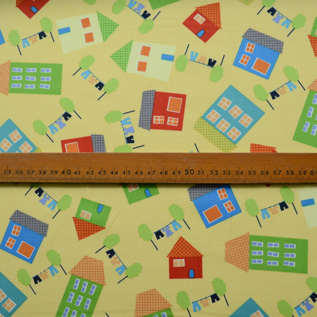 Clothworks Tumble Town Yellow House Print Cotton S