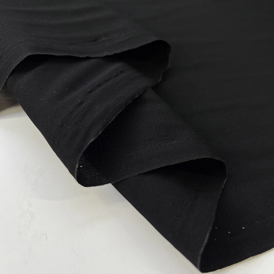 Core Range Polyester Peach Finish Black Lightweight Woven Dress Fabric Fold