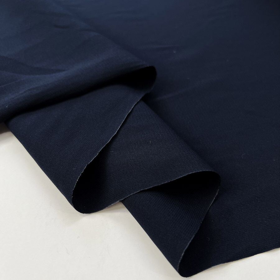 Core Range Polyester Peach Finish Navy Lightweight Woven Dress Fabric Fold