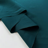 Core Range Polyester Peach Finish Teal Lightweight Woven Dress Fabric Fold