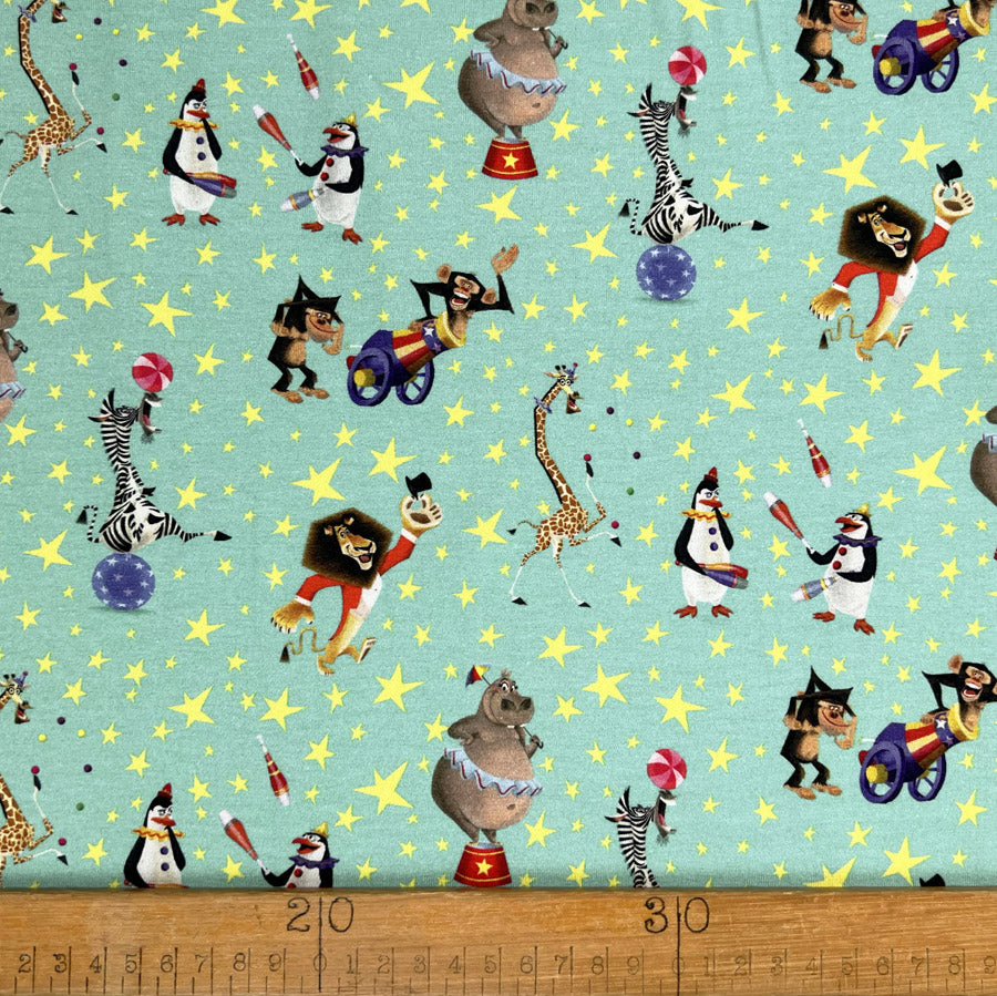 Cotton Elastane Jersey Fabric Licensed Madagascar Aqua Circus Print Ruler