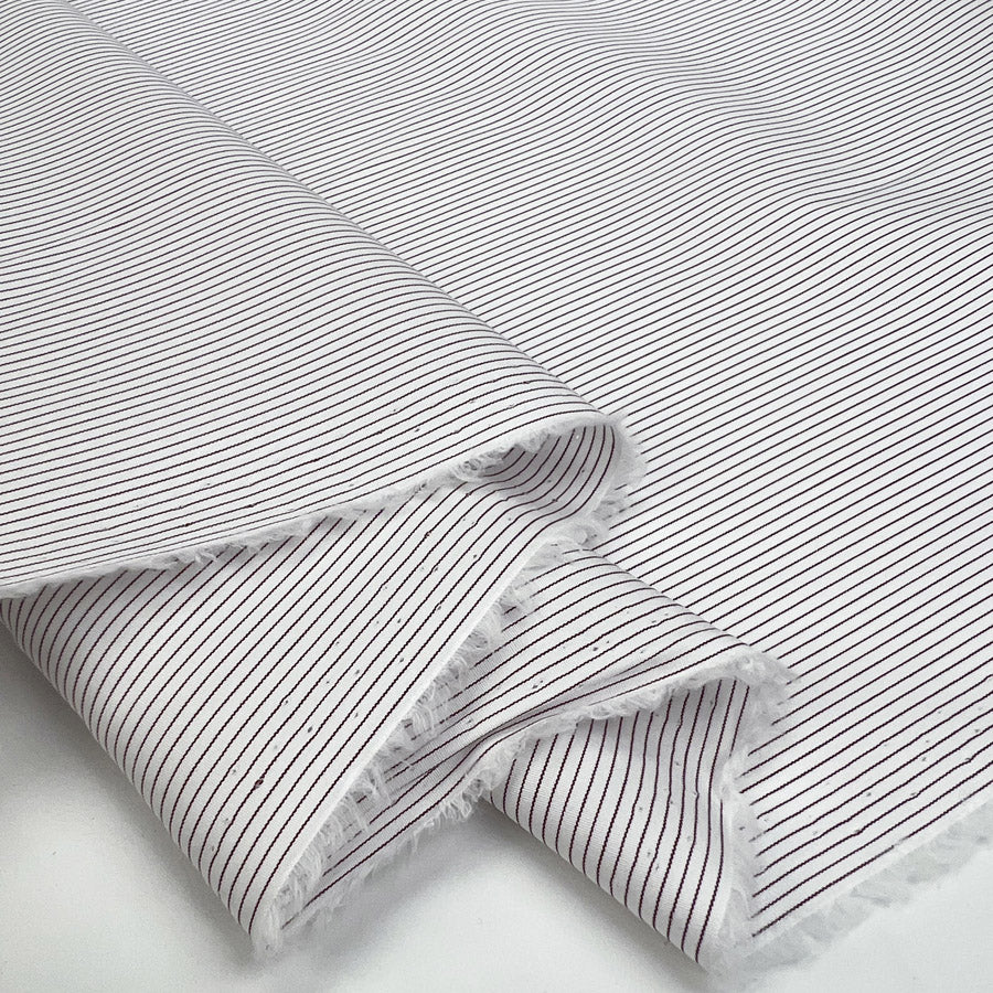 Damson Pinstripe Cotton Stripe Italian White Burgundy Shirting Fabric Fold