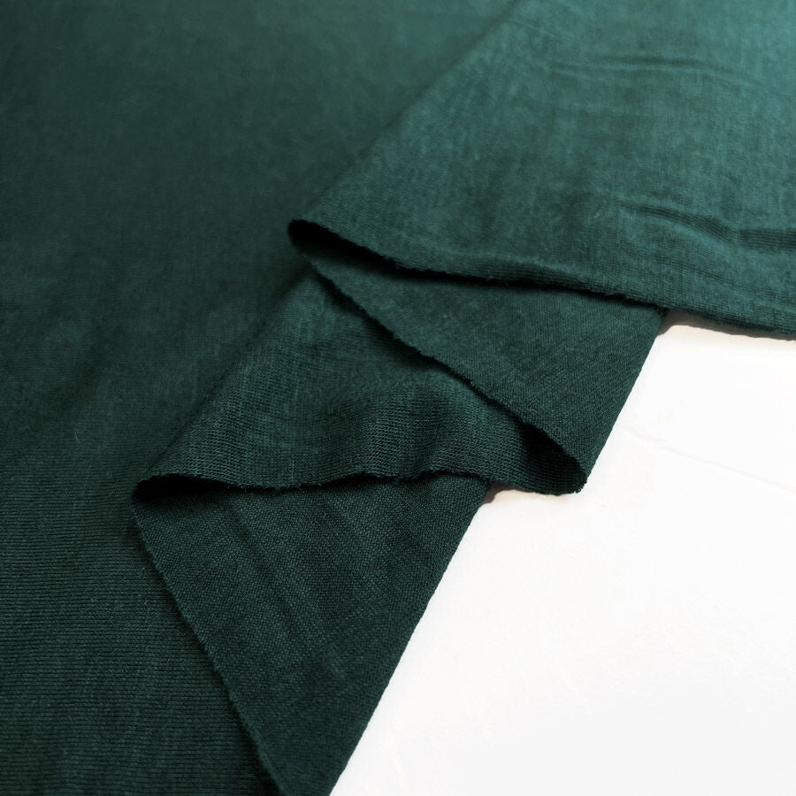 Daylight Robbery Forest Green Knitted Nylon Cashmere Fine Jersey Fabric Fold
