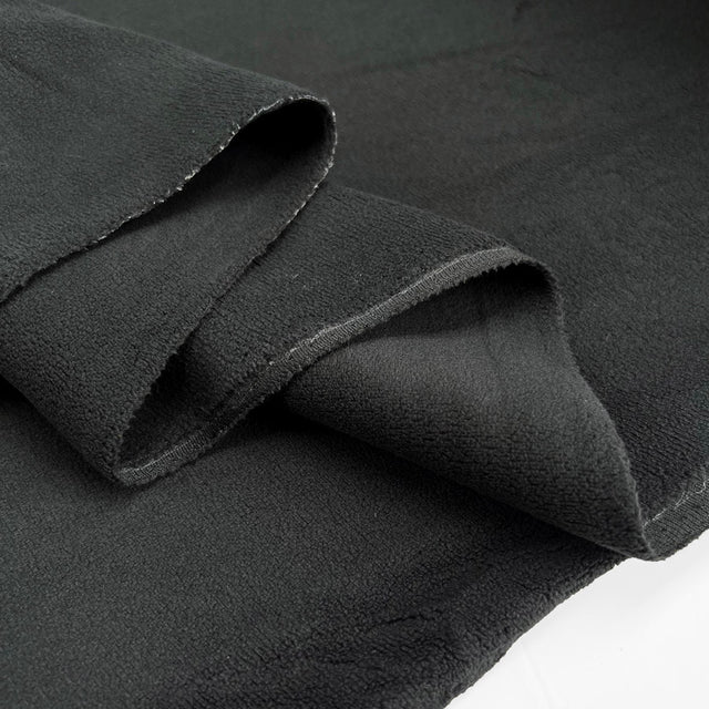 Double sided stretch fleece black polyester spandex fabric fold