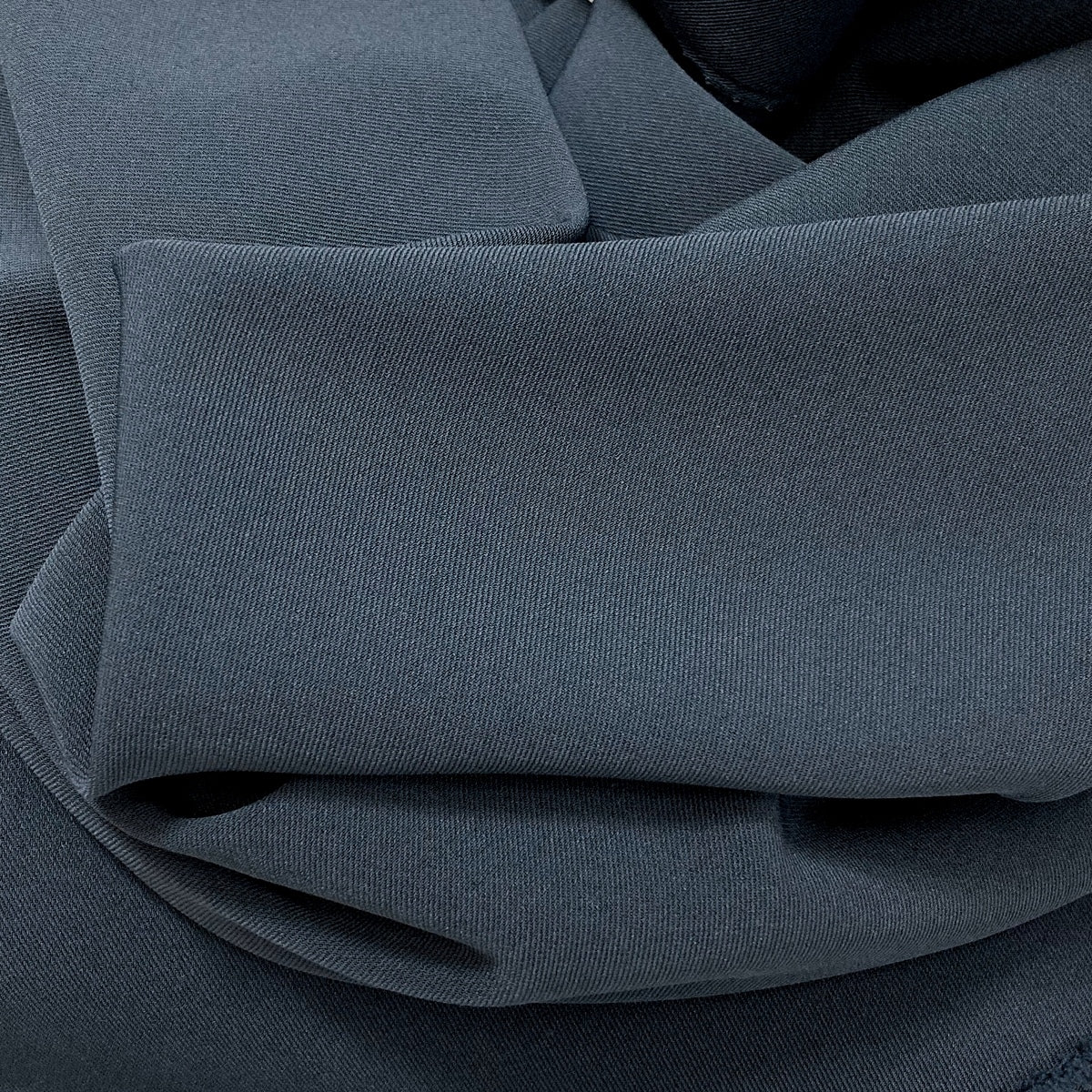 Dynasty Teal Two Way Stretch Drapey Polyester Spandex Suiting Fabric Fold