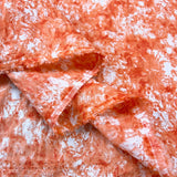 End Of The Road Flame Orange Cotton Seersucker Tie Dye Print Dress Fabric Fold