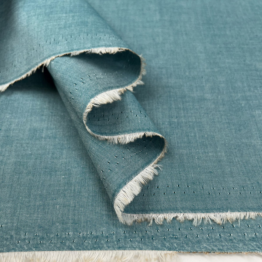 Finest Chambray Teal Cotton Lightweight Plain Woven Dress Fabric Fold