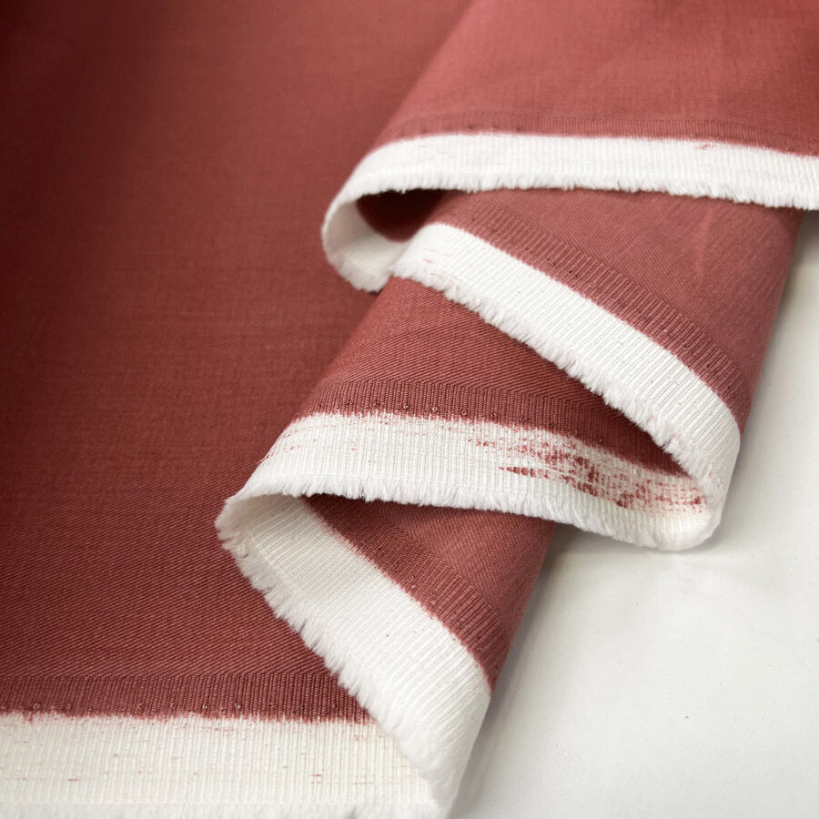Flying For Me Rose Red Fine Cotton Twill Trousering Fabric Fold