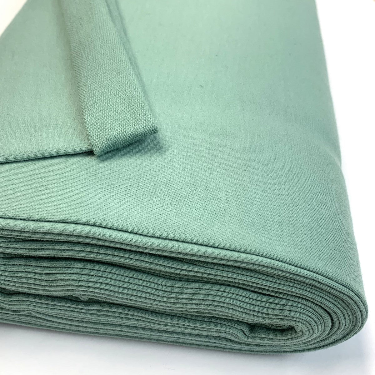 French Terry Sea Green Plain Dusky Mint Coloured French Terry Sweatshirt Knitted Jersey Fabric Close Up Drape Fabric Photo Custom