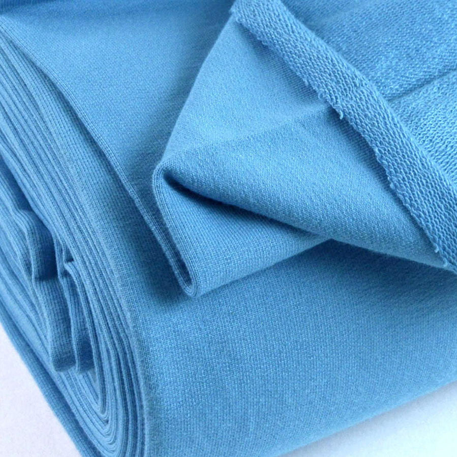 French Terry Turquoise Jersey Fabric With A Looped Back Scale Fabric Close Up Photo