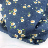 Heavenly evening daisy lightweight multicoloured cotton printed denim chambray shirting fabric roll close up fabric photo