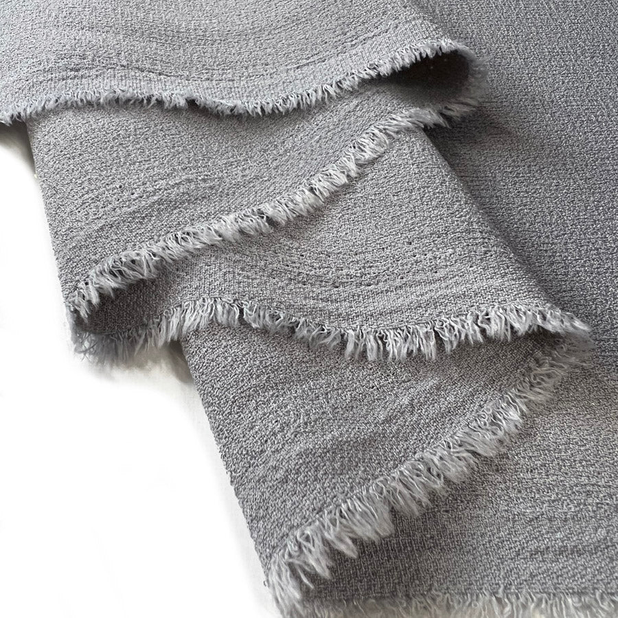 Lorien Crepe Grey Polyester Dressmaking Fabric Fold