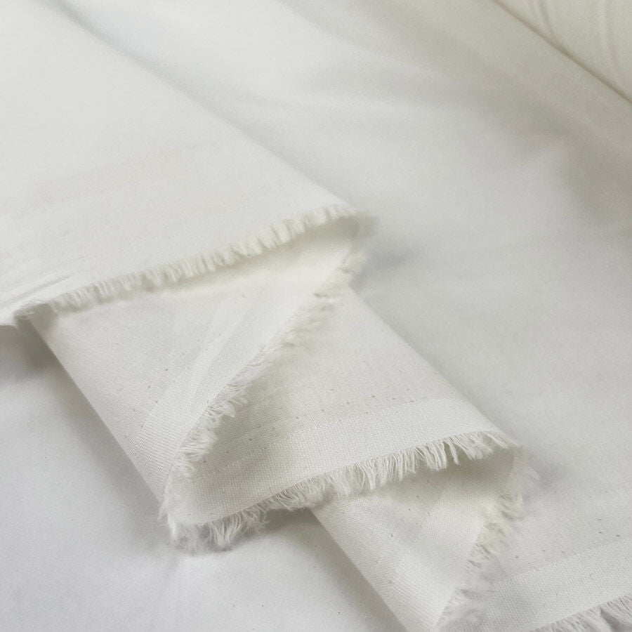 Lovely Lawn Pale Cream Cotton Plain Woven Dress Fabric Fold