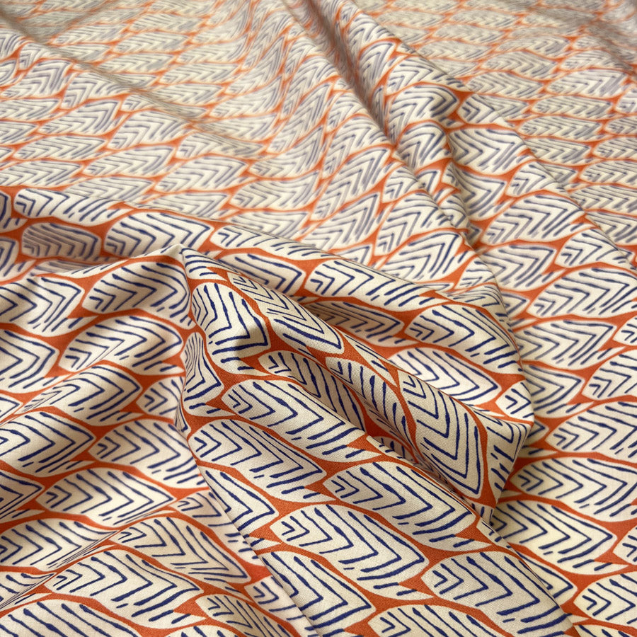 Pima Cotton Lawn Tribal Grove Orange Leaf Print Blue Woven Dress Fabric