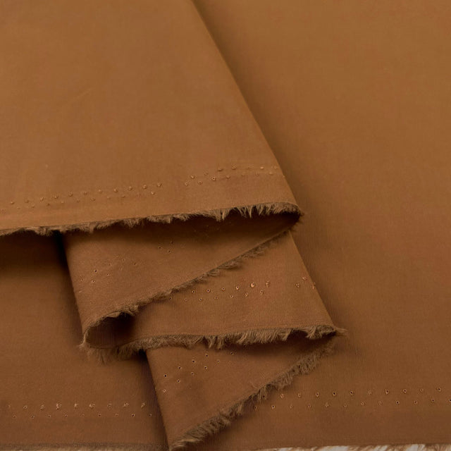 Poly cotton memory shirting fabric brown tobacco road fold