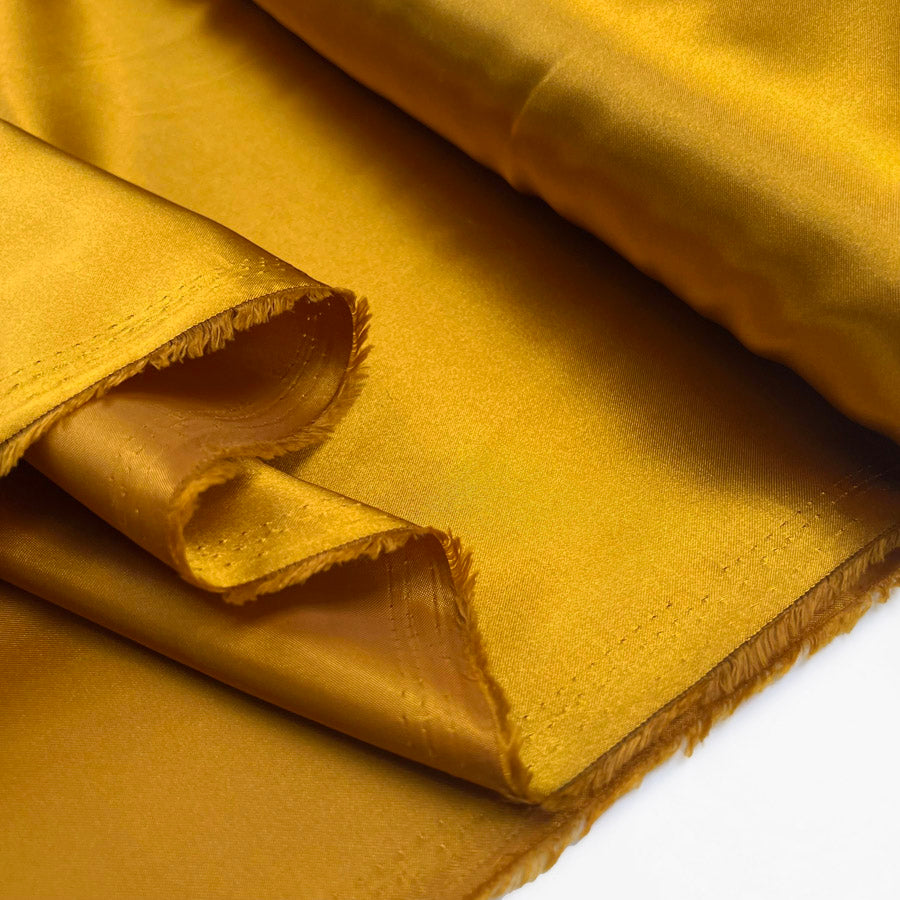 Polyester Satin Dress Fabric Lumos Lining Gold Fold