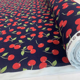 Poplin Print Cherries Navy Cotton With Red Cherries On And Green Leaves Roll