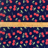 Poplin Print Cherries Navy Cotton With Red Cherries On And Green Leaves Scale