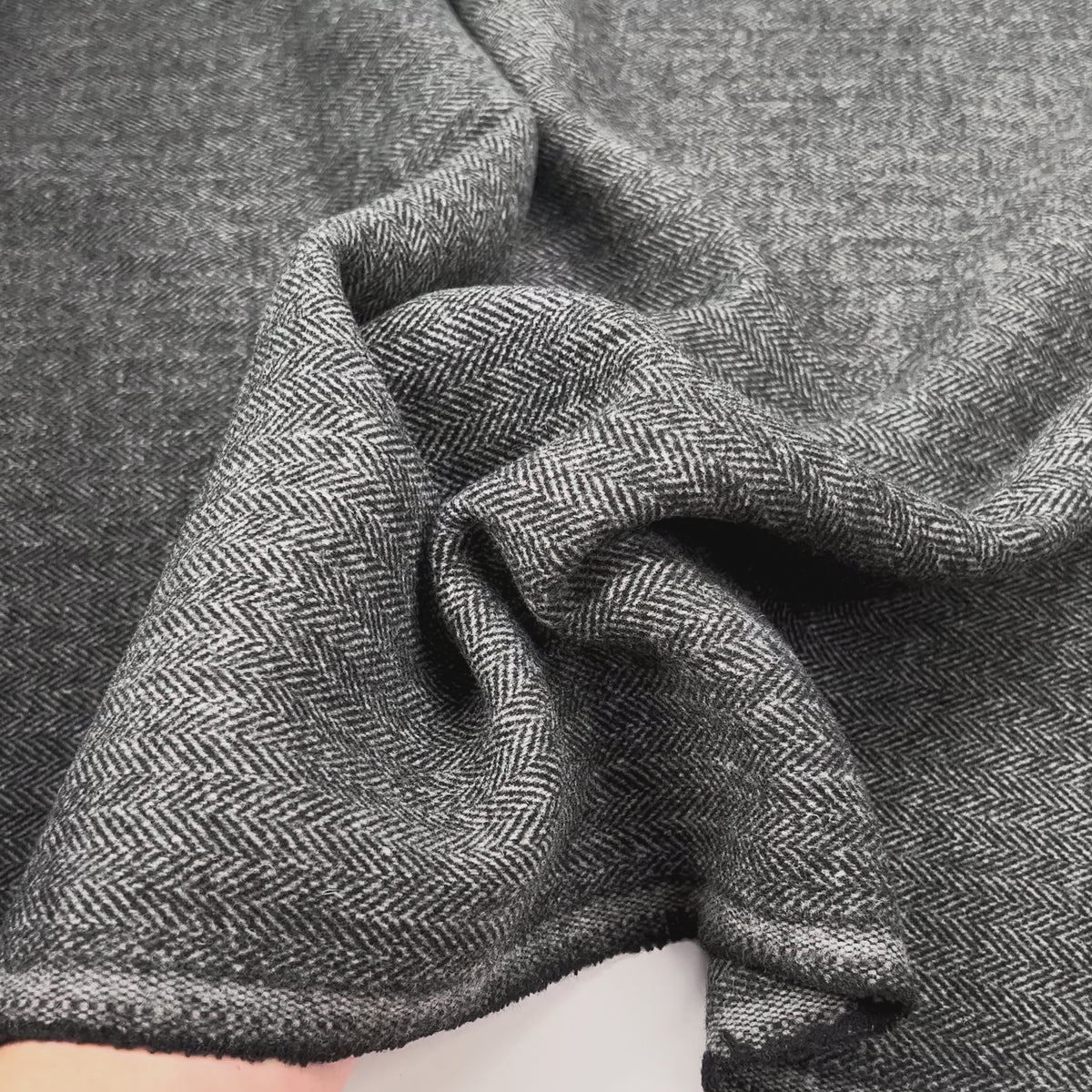 Silent Patient Wool Polyester Mix Black Grey Herringbone Woven Coating Fabric Vid