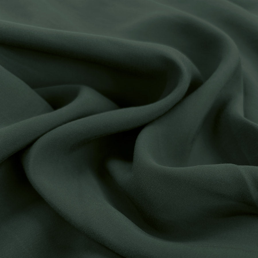 Sandwashed teal polyester viscose blend dressmaking fabric cu