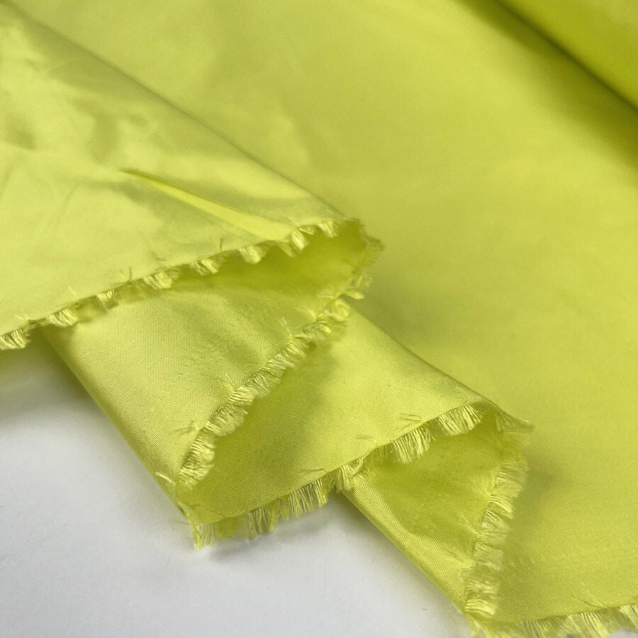 Silks Of Italy Zesty Acid Yellow Woven Dress Fabric Fold
