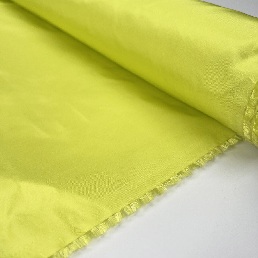 Silks Of Italy Zesty Acid Yellow Woven Dress Fabric Roll