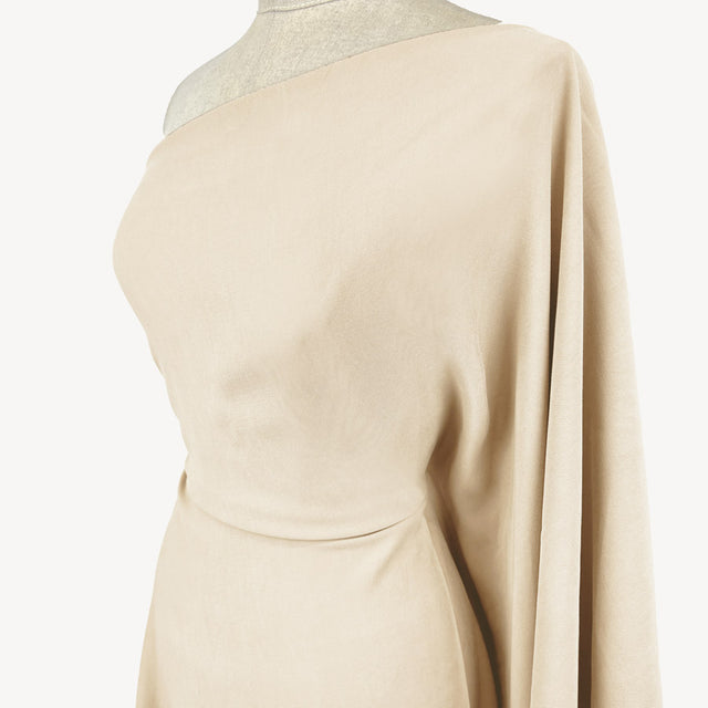 Smooth Rider Ivory Viscose Tencel Finish Dressmaking Fabric Side